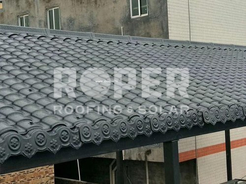 Traditional gray tile roof with decorative border on residential building